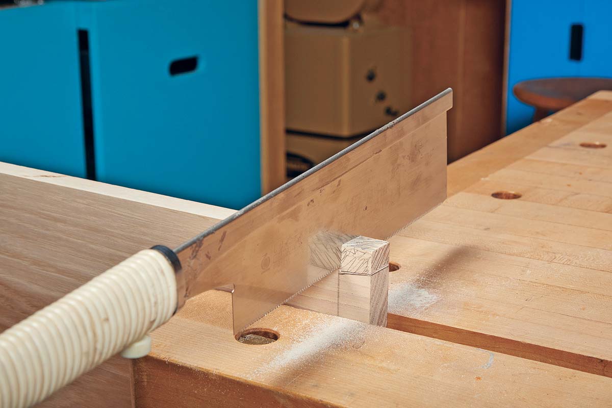 using back saw to remove waste at the ends