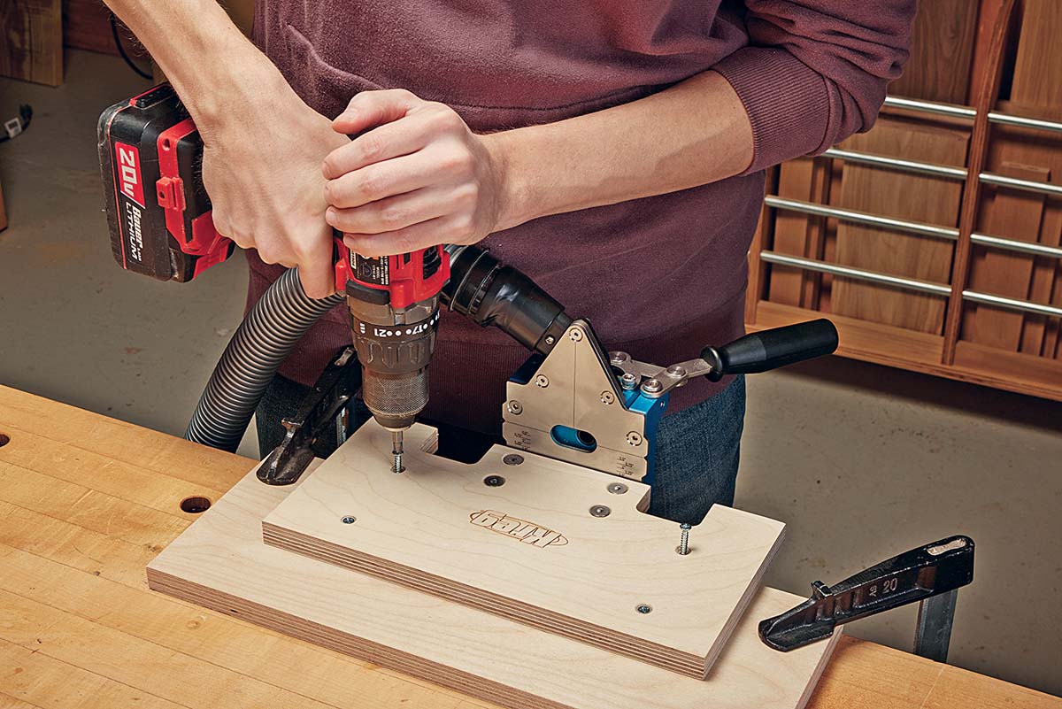 Attaching an auxiliary base to main base with drill