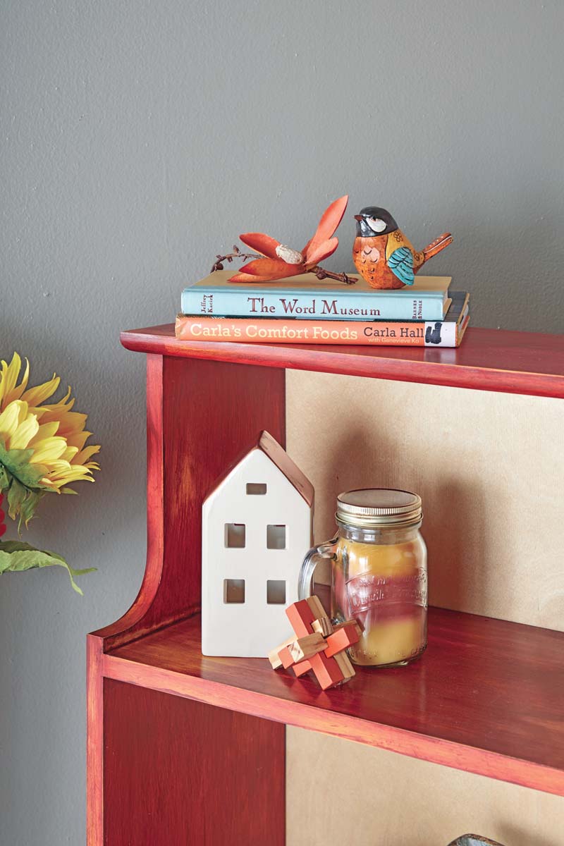 overhang of red painted pine bookshelf