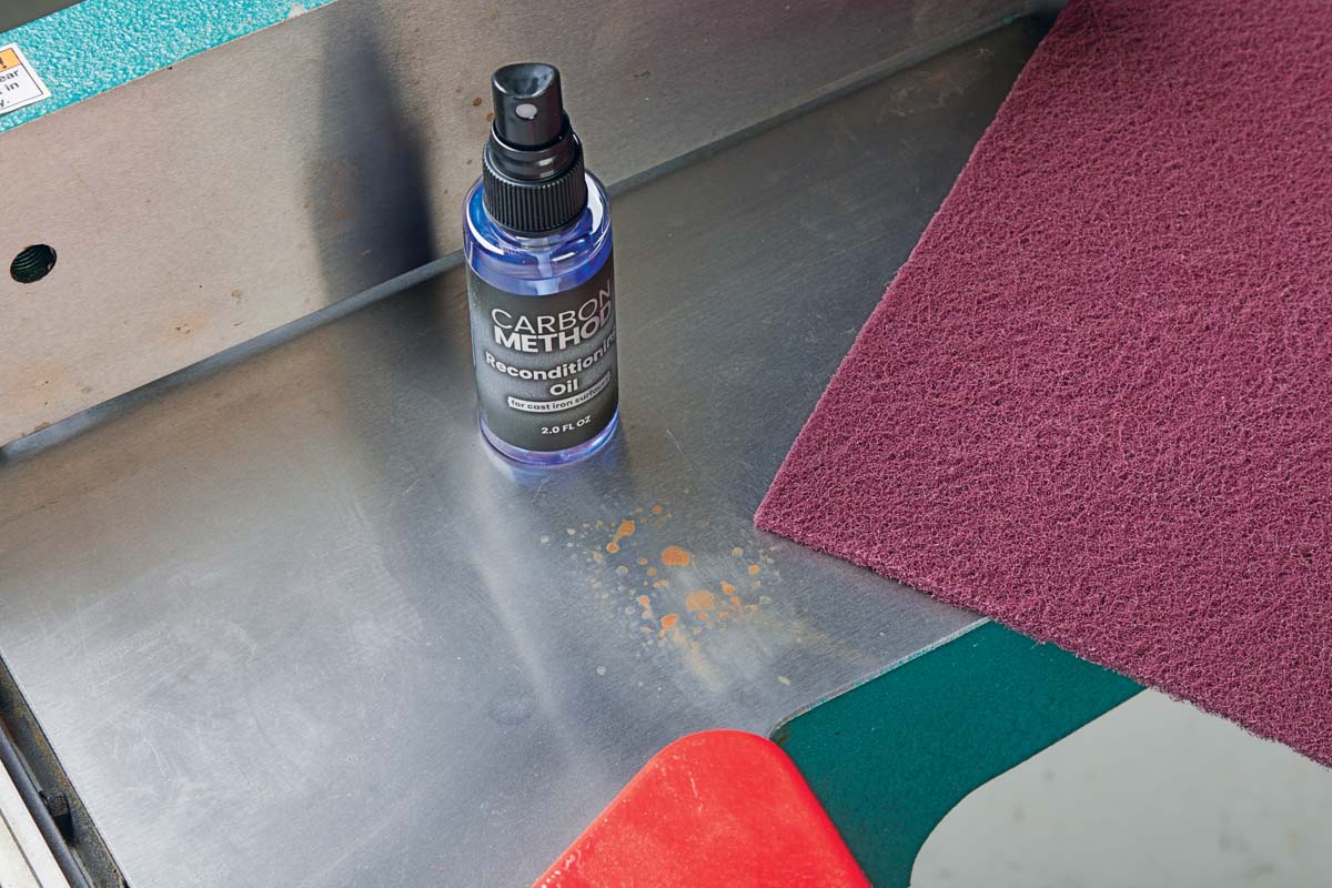 carbon method spray and abrasive pad about to be used on rust spot