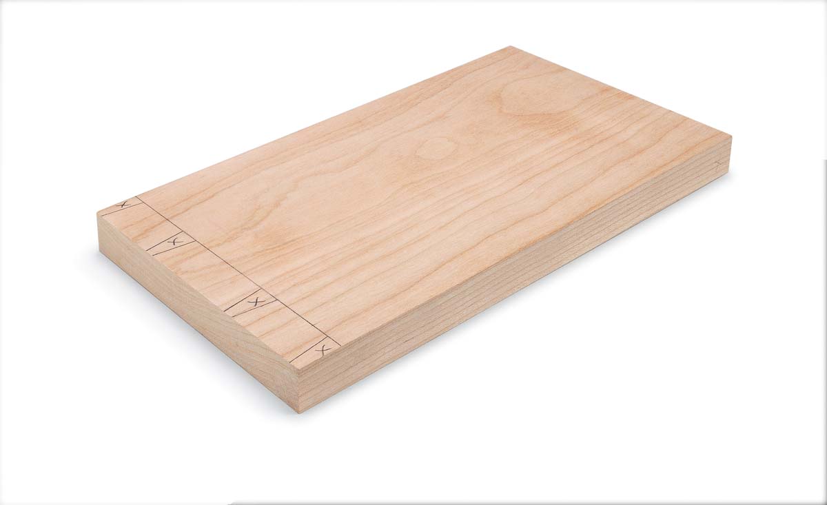 wood piece with pencil markings made for cutting dovetails