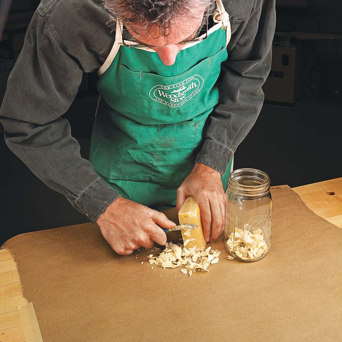 shaving beeswax into mason jar