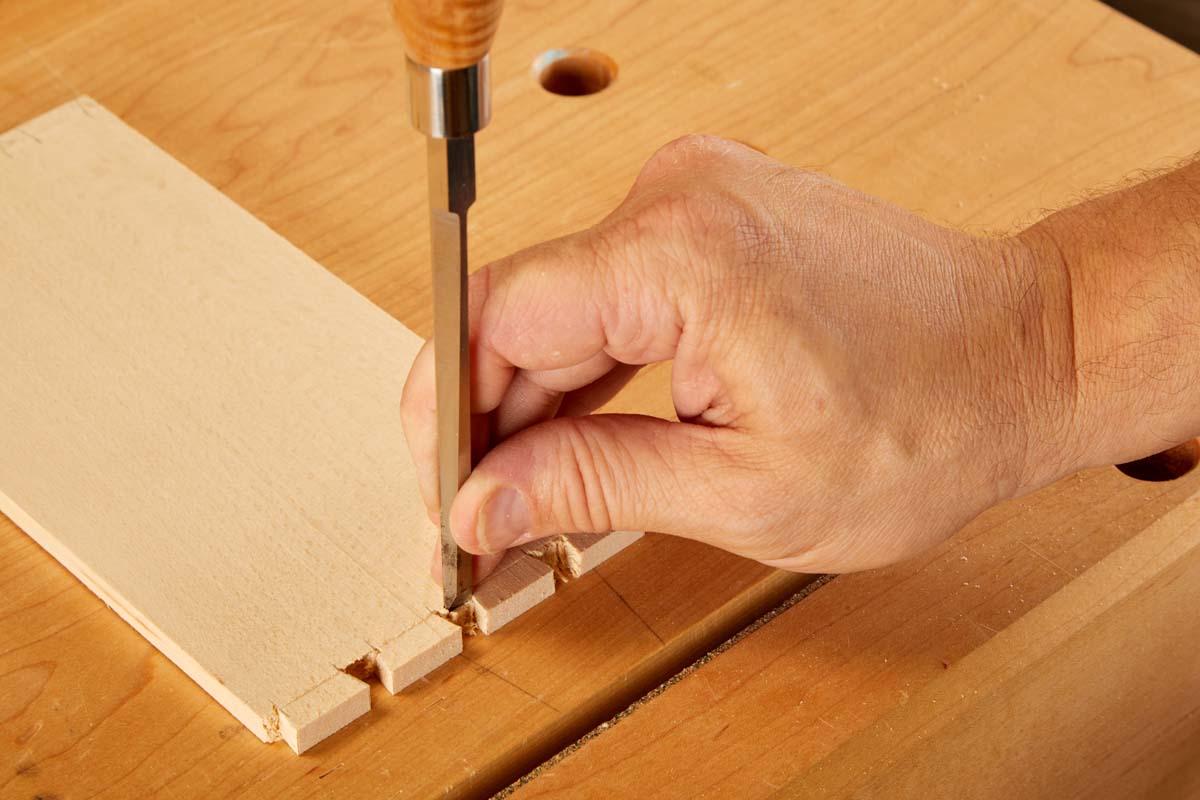 using chisel and mallet to clean up dovetails