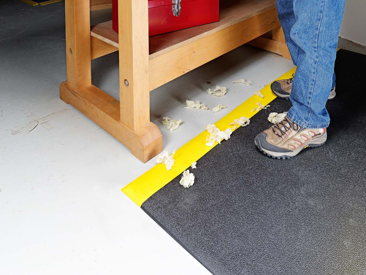 taped down anti-fatigue floor mats installed by workarea