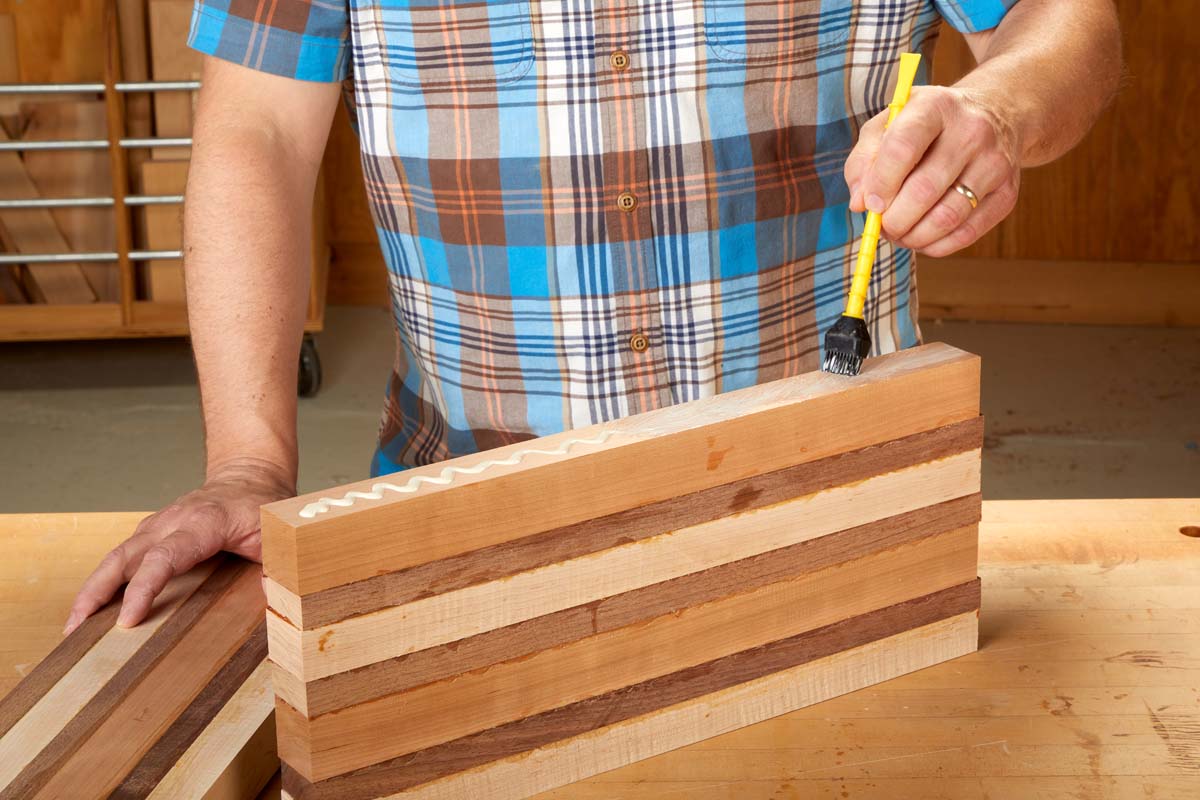 titebrush spreading glue on end of wood