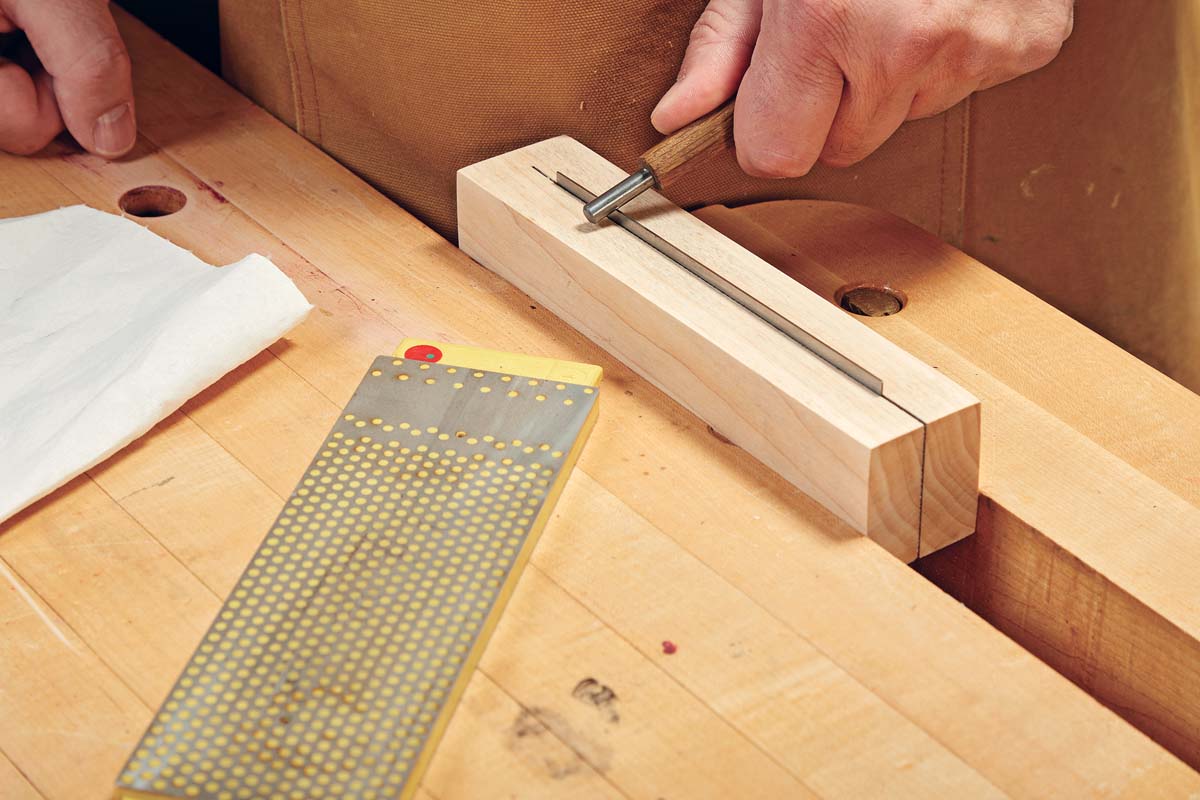 using burnisher shape at an angle on card scraper