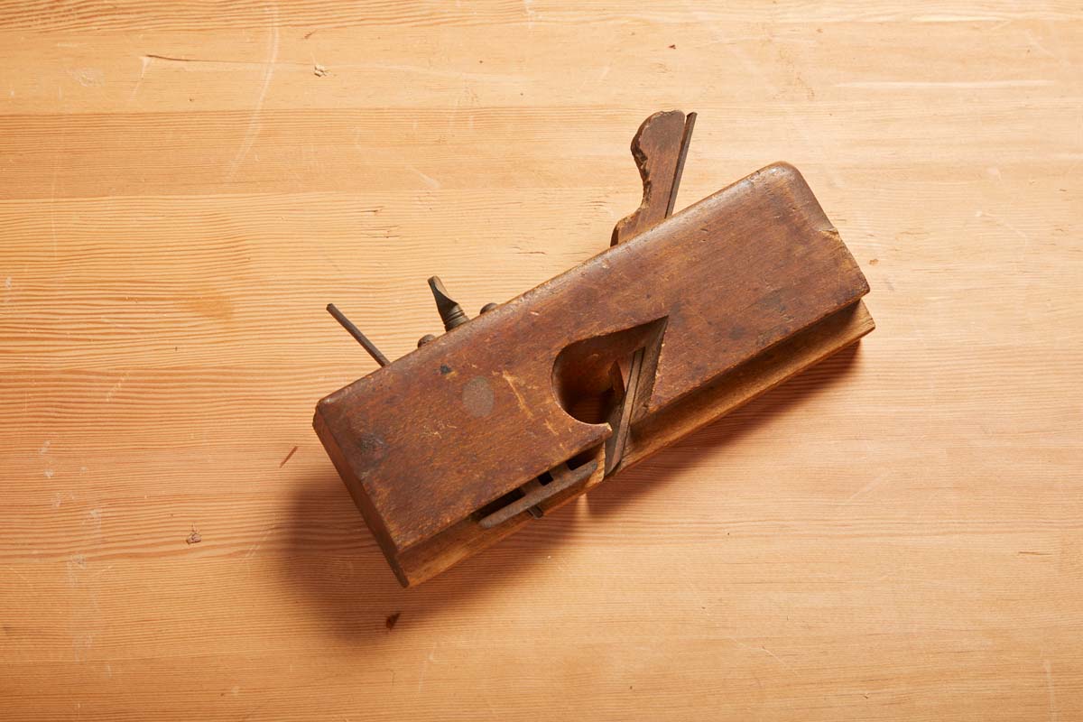 image of dado plane with rusty iron, chewed up wedge, and missing wedge
