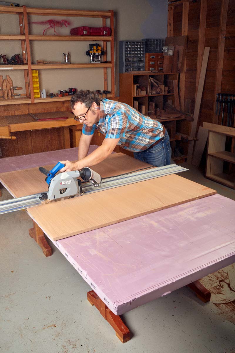 cutting plywood on purple foam insulation with kreg track saw