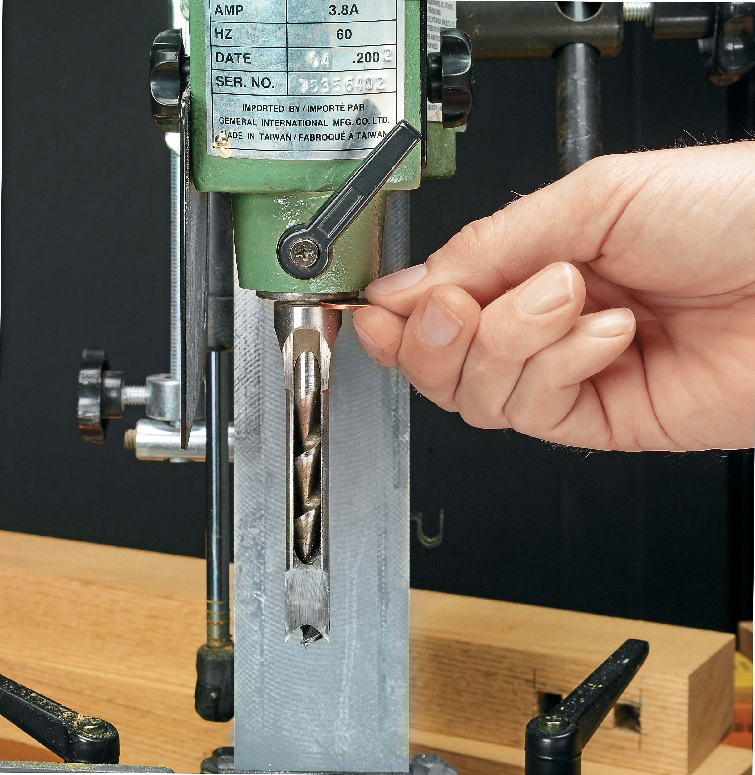 Image of auger bit setup properly in chisel