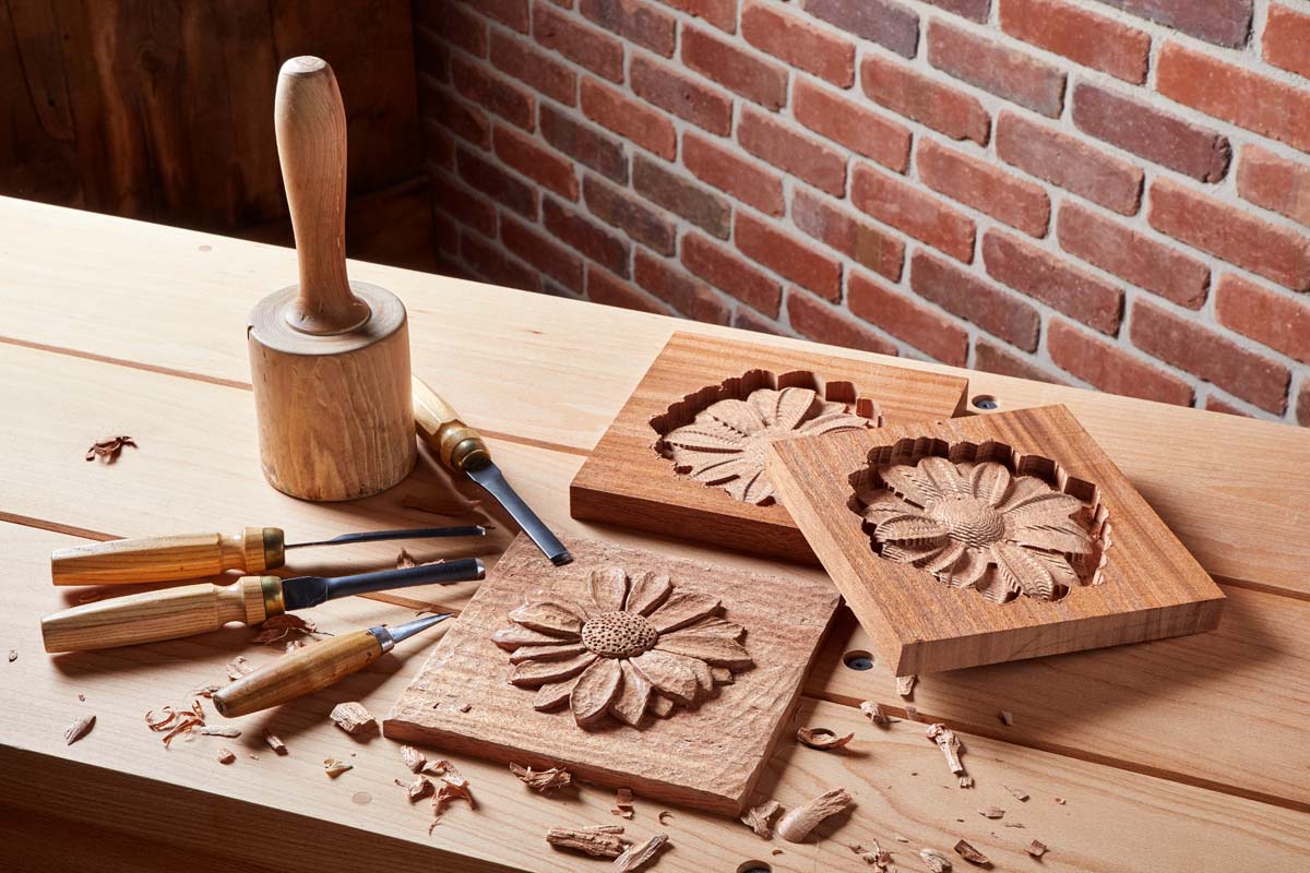 multiple sunflower relief carving made CNC being finished with wood carving chisels