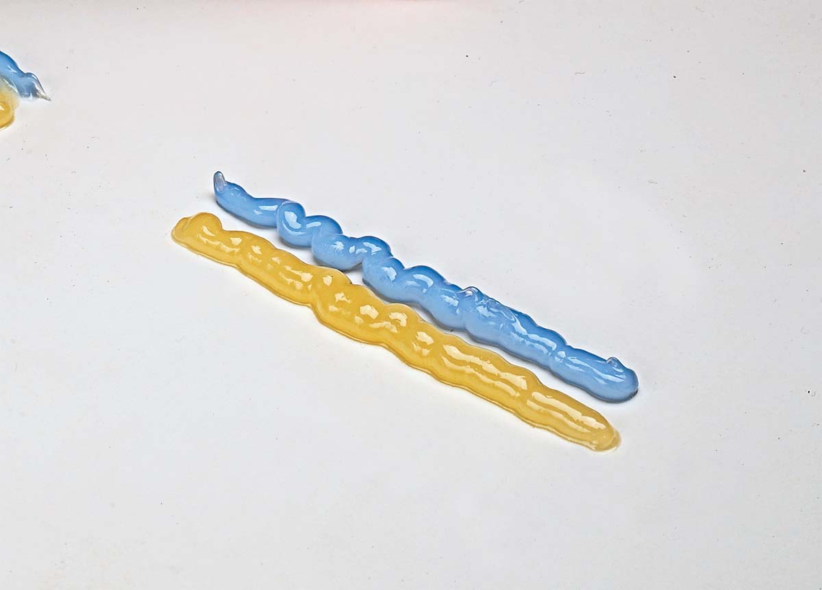 resin and hardener squeezed out on table