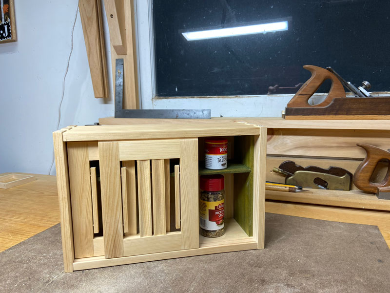 Spice cabinet with open door