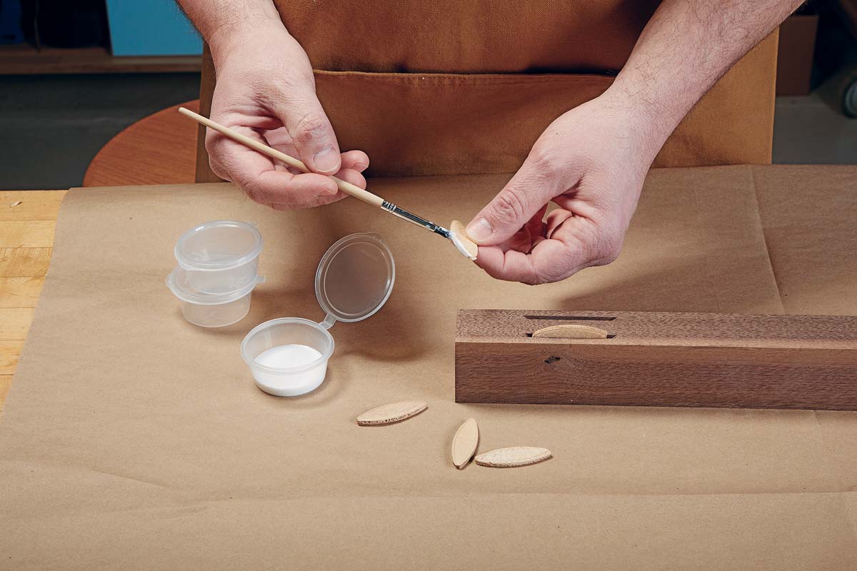 image shows platic ramekins or containment container, beind used to hold glue