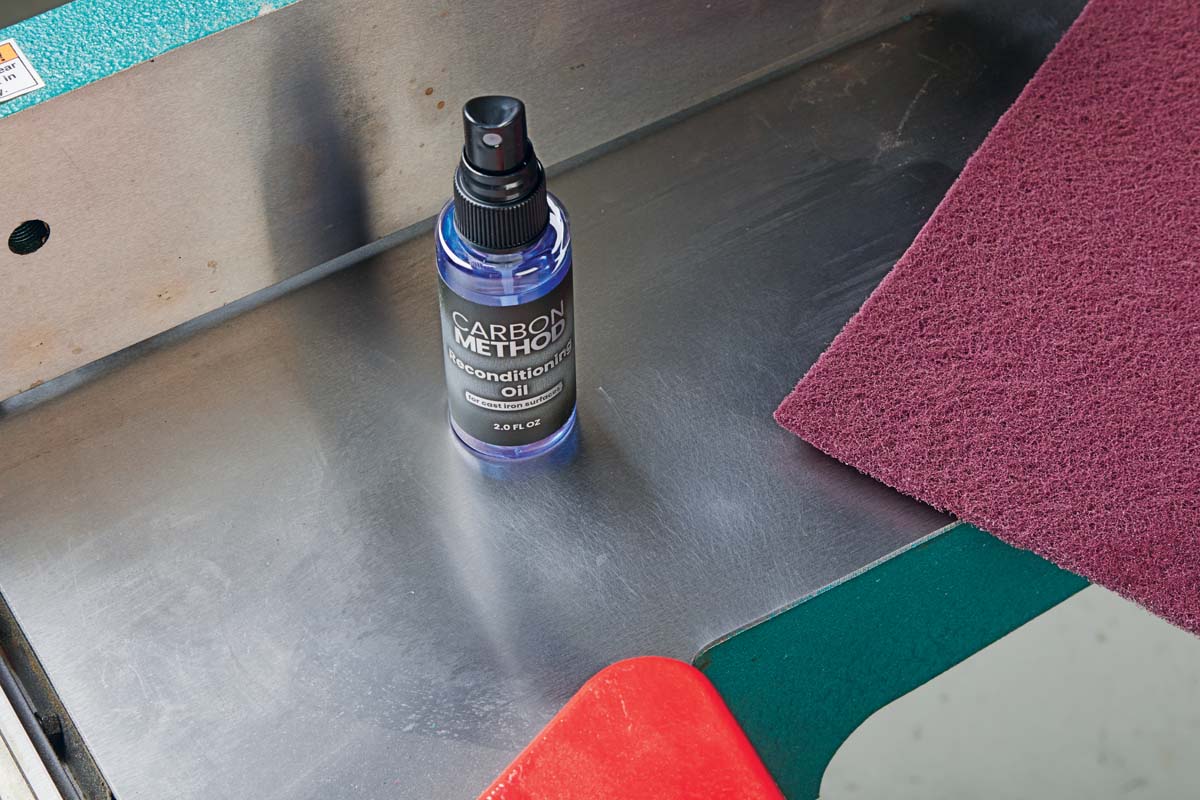 image shows clean metal table after having beed scrubbed with abrasive and fine pads