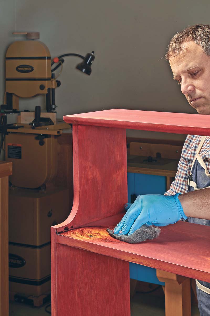 applying pigmented brown wax with abrasive pad