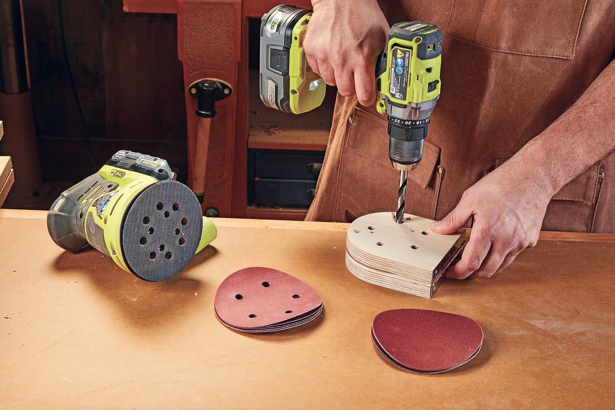 drilling holes into wood guide for making sanding disc holes