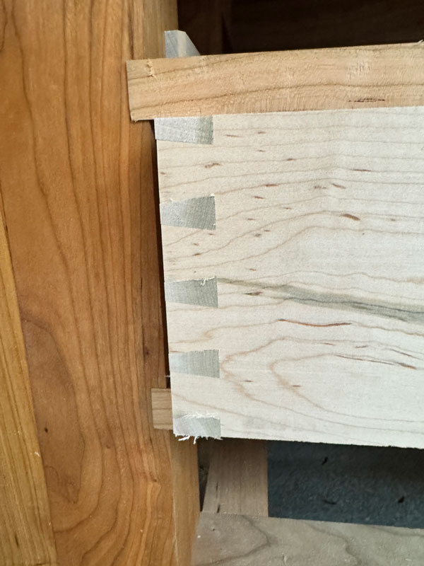 Dovetailed drawers gone wrong.