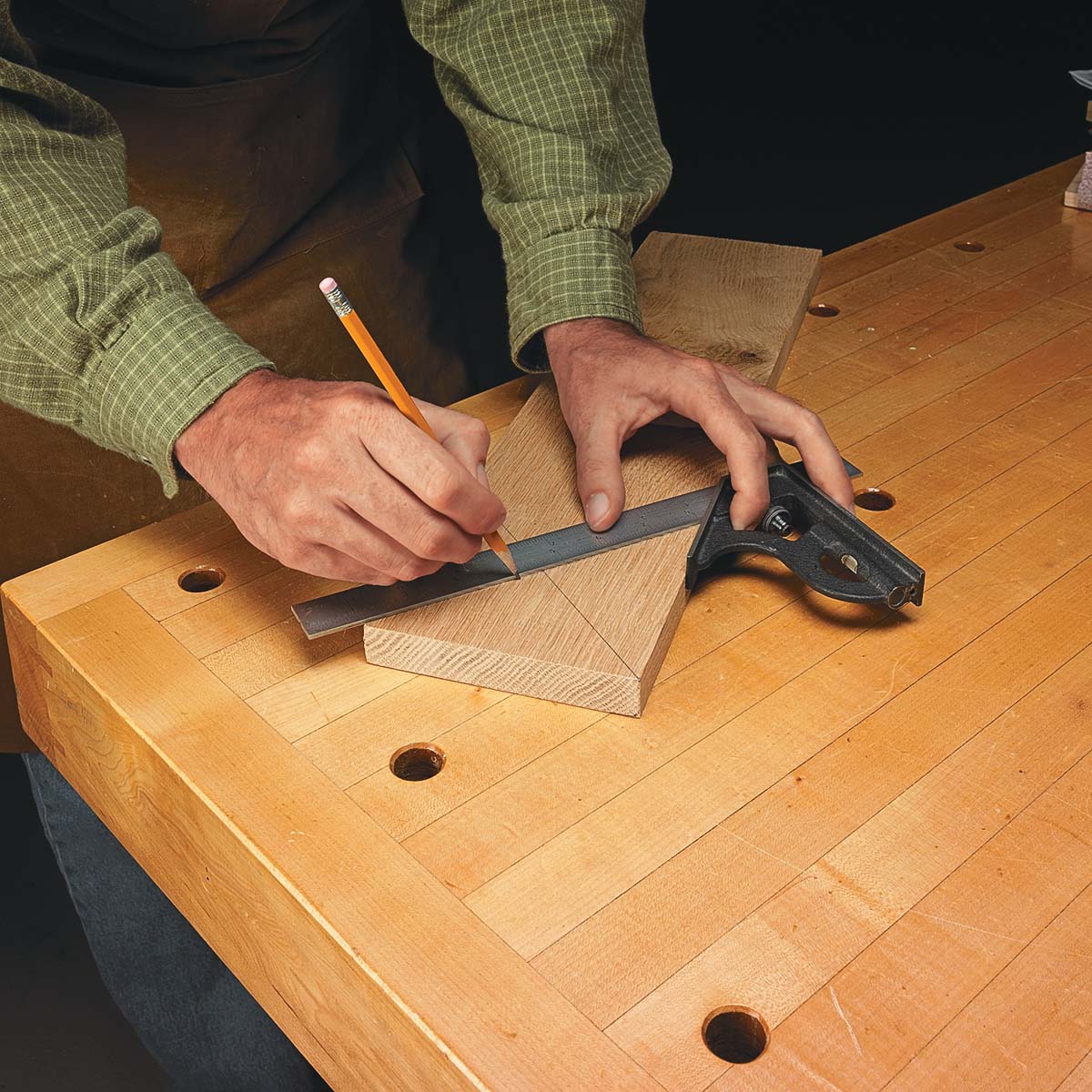 Using combination square to make pencil lines on wood workpiece