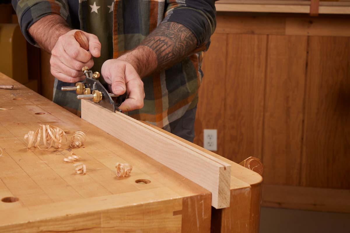 plow (plough) plane cutting with long strokes on workpiece