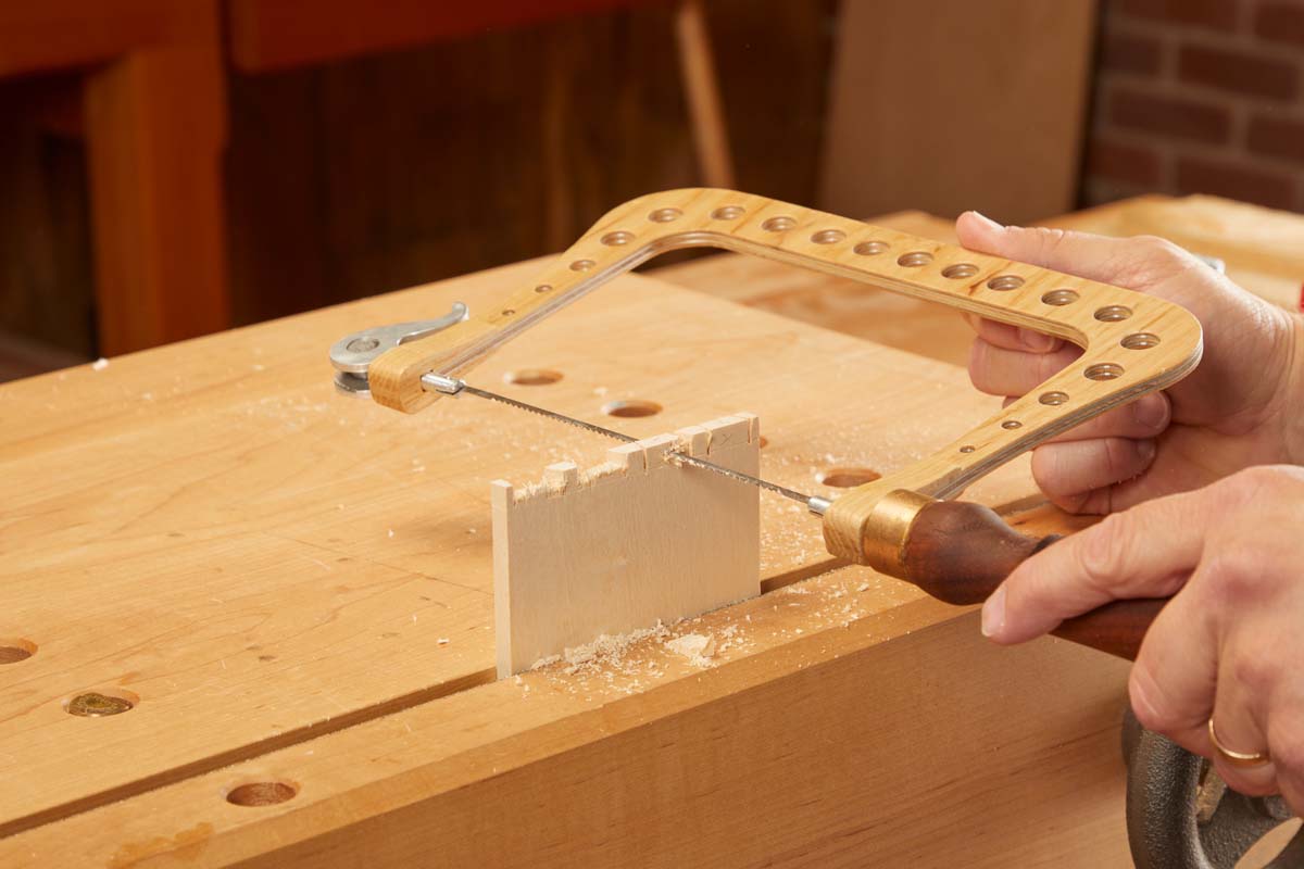 using coping saw to cut parallel at an angle to the pins