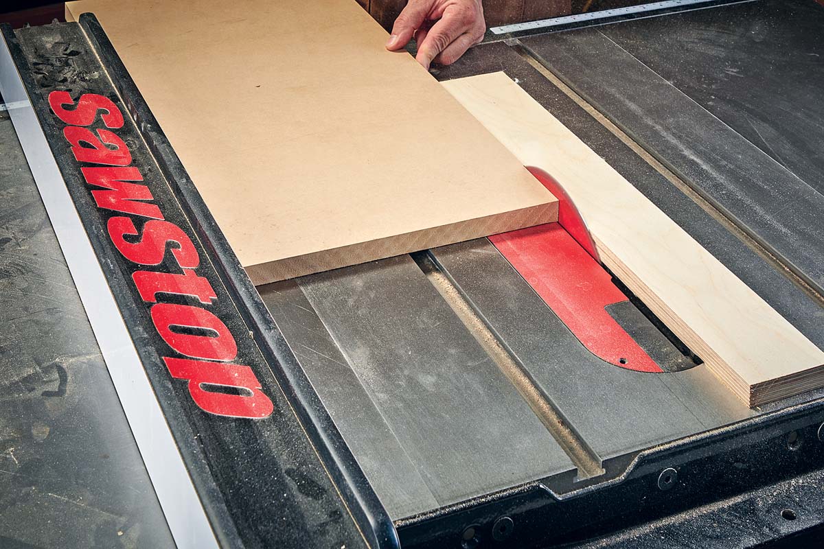 sliding board along table saw, between dust strip and rip fence