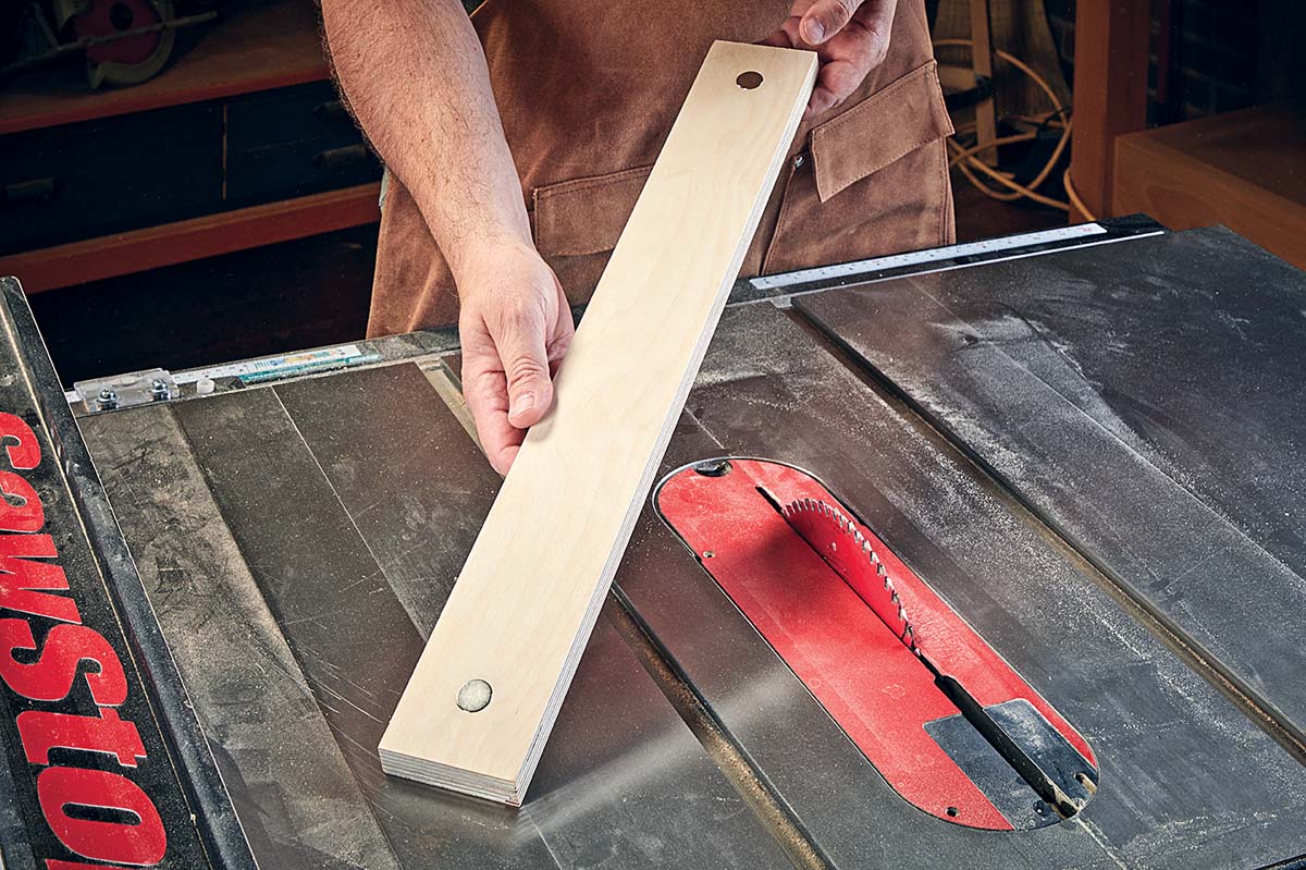 strip of plywood with magnets added to each end