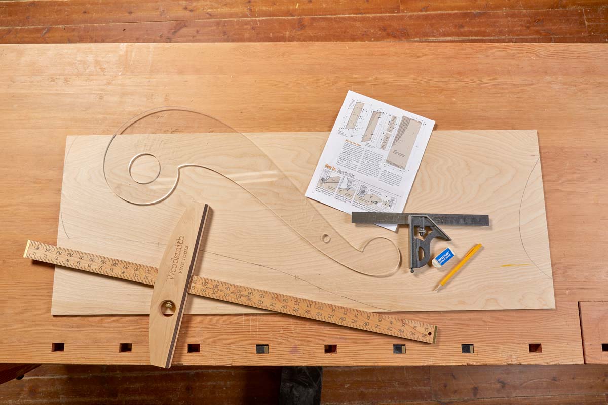 French curve acrylic template, t square rulers, pencil, eraser, and plywood