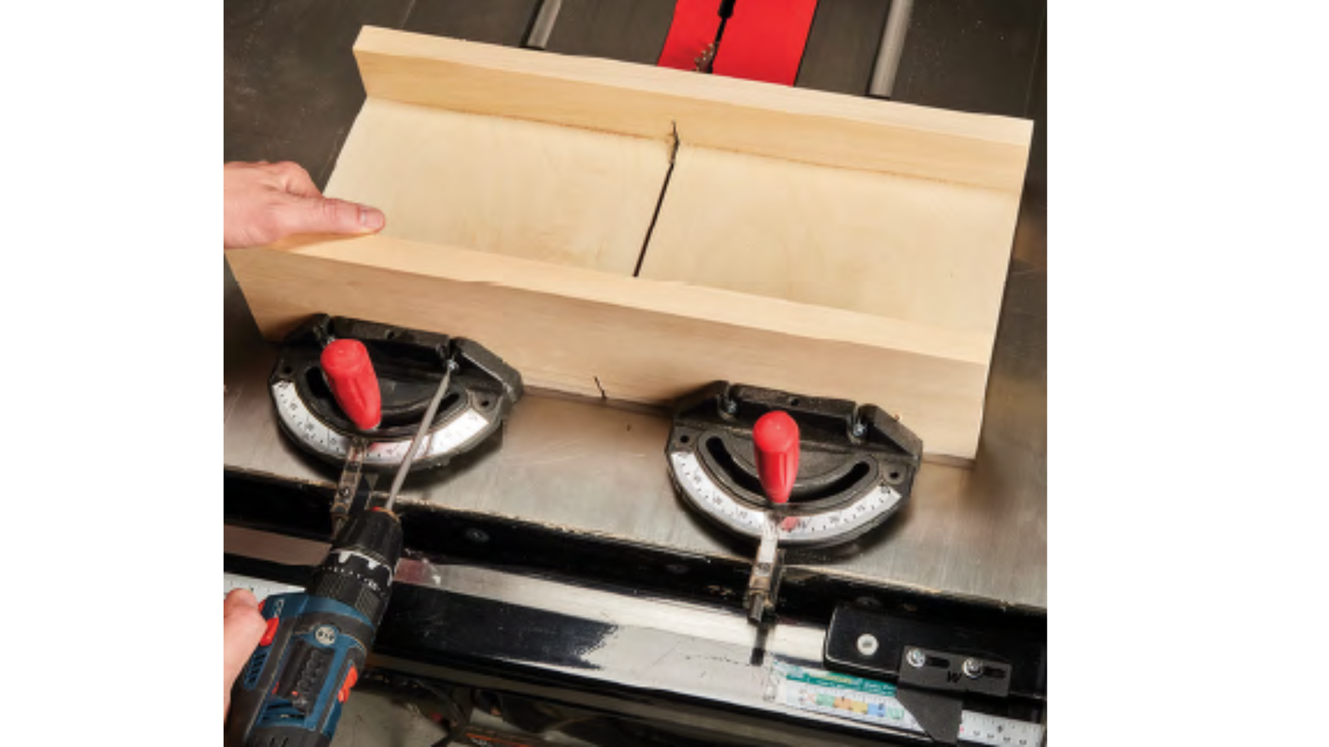 Image of miter gauge sled using miter gauges screwed into place on the sled