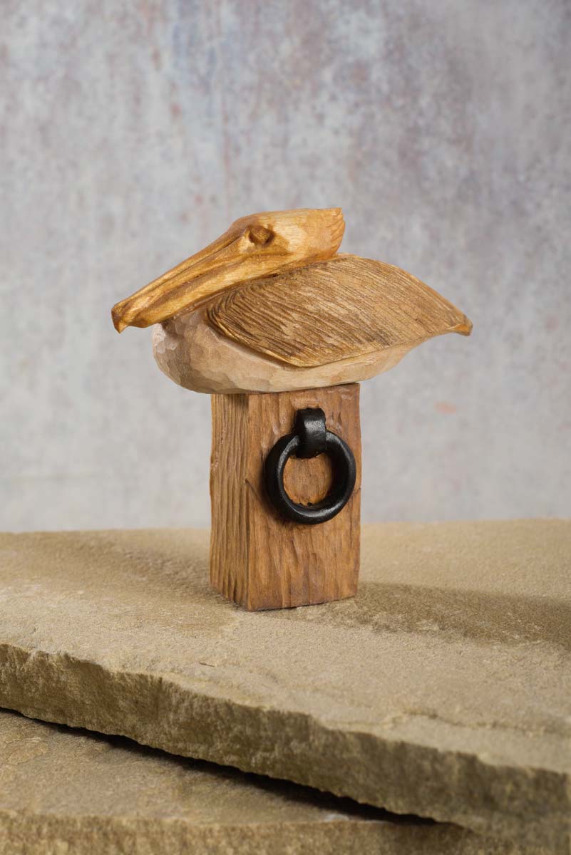 woodcarving of seagull on doc post