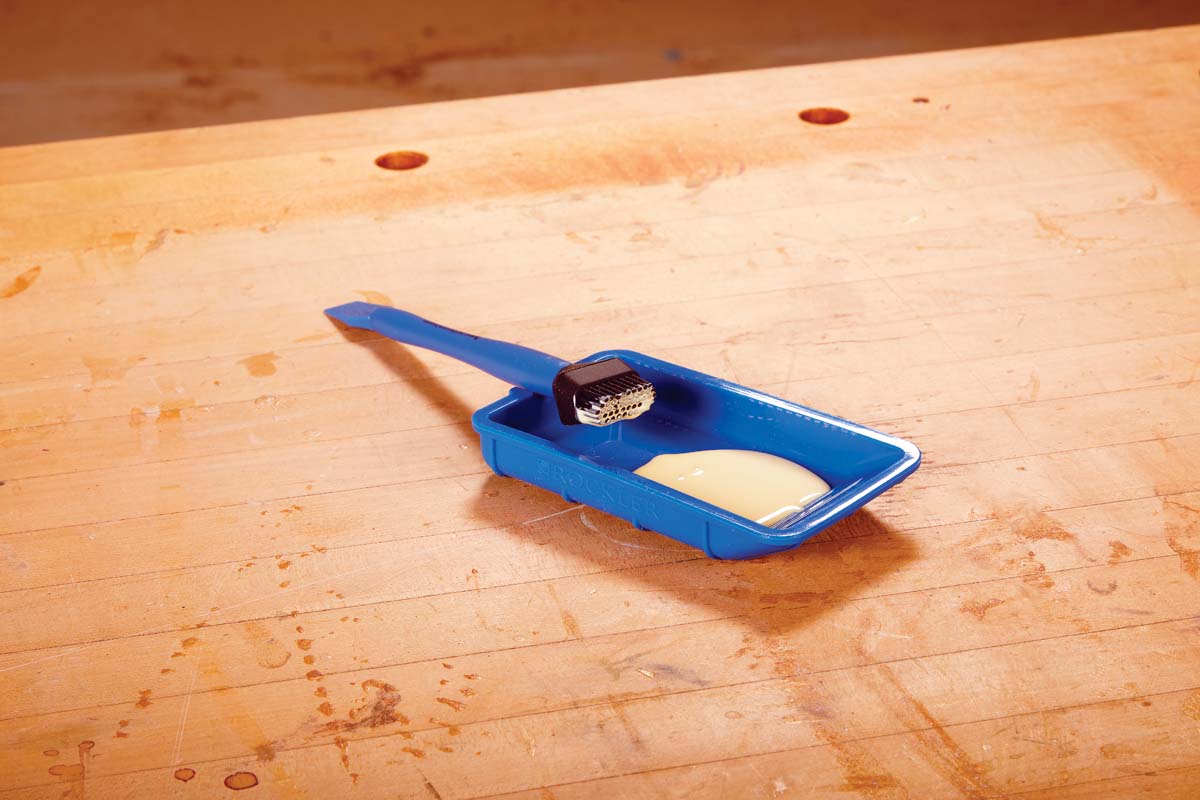 glue brush and tray filled glue