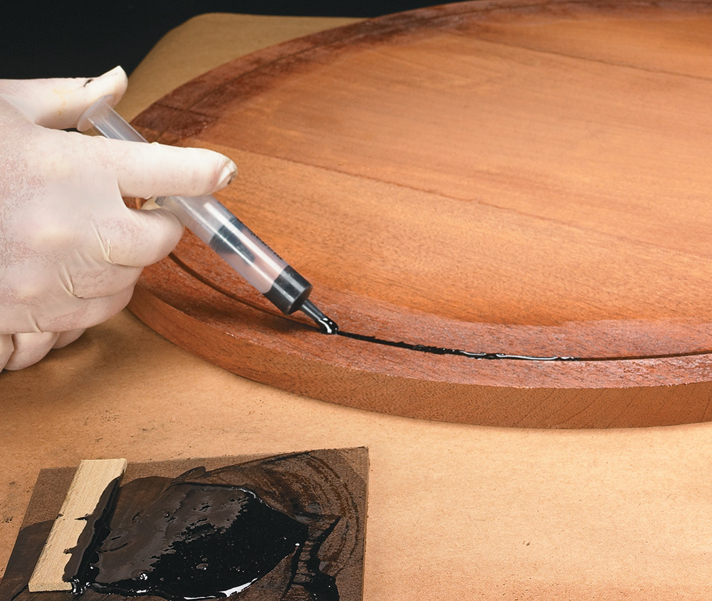 Using plastic syringe to apply epoxy