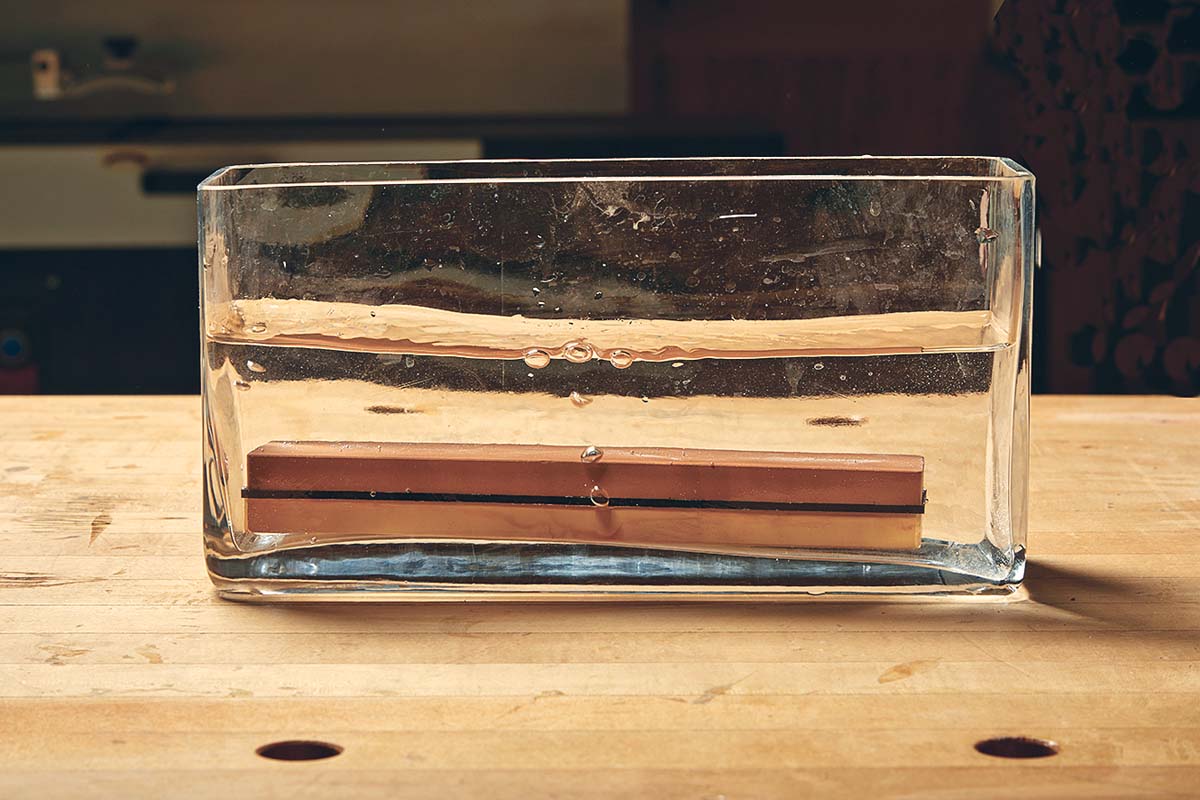 soaking waterstone in rectangle glass vase or jar