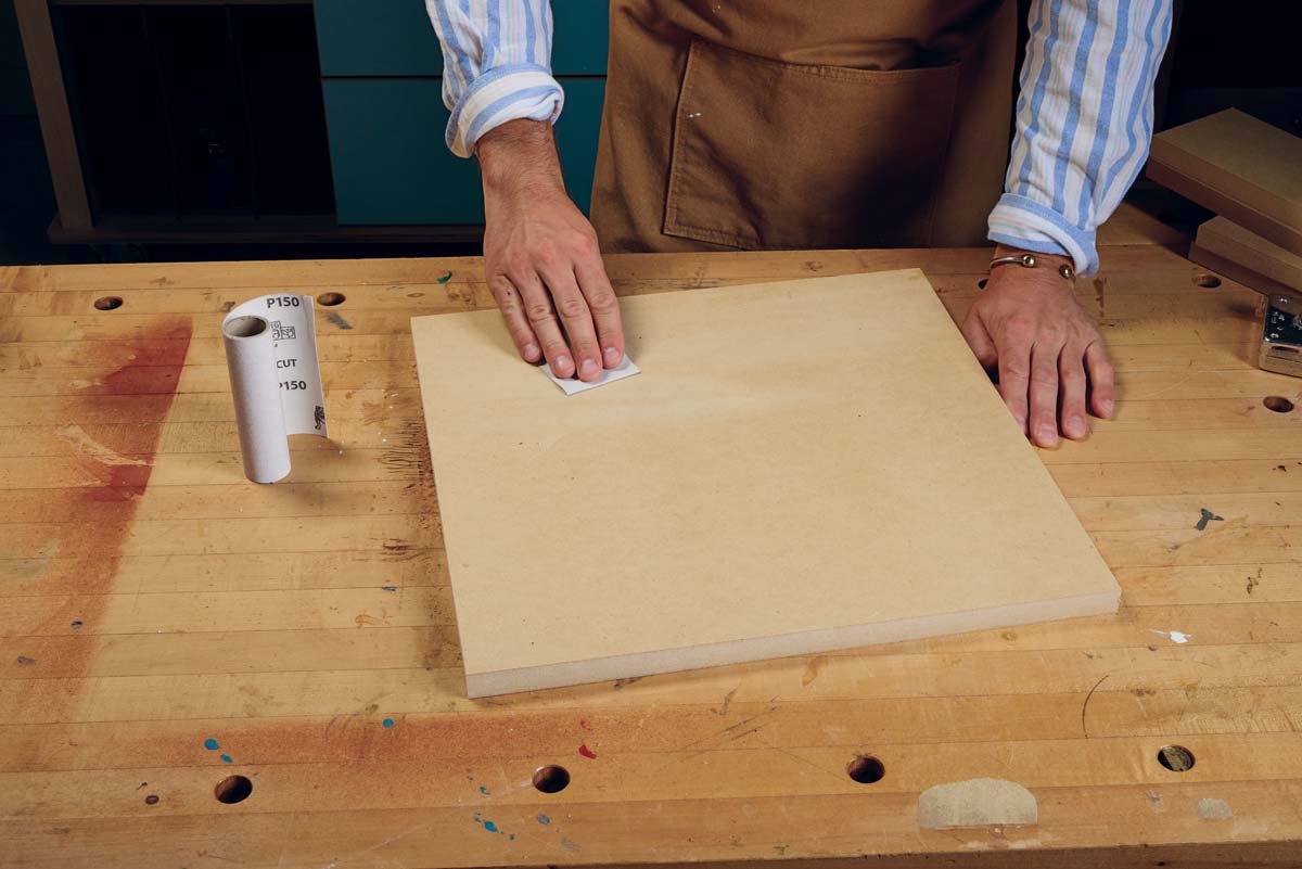 sand the mdf board to break glaze