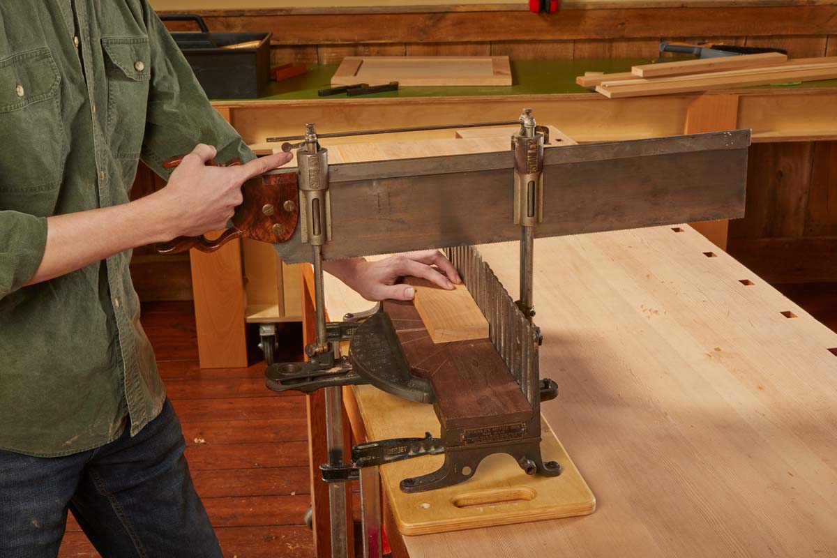 tripping the hammer on the closest cylinder to release it and lower the saw handle