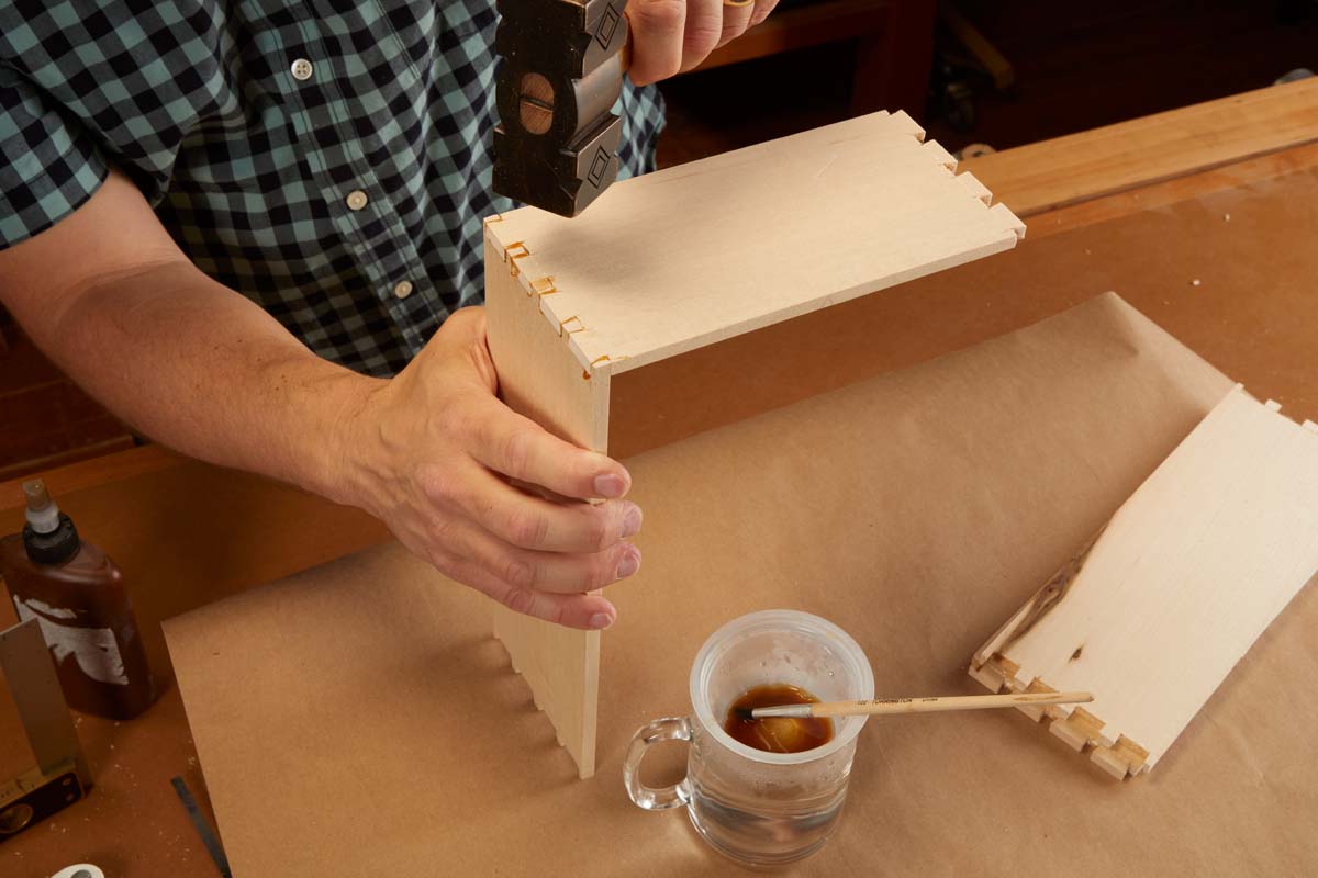 using mallet to lightly hammer dovetails into each other