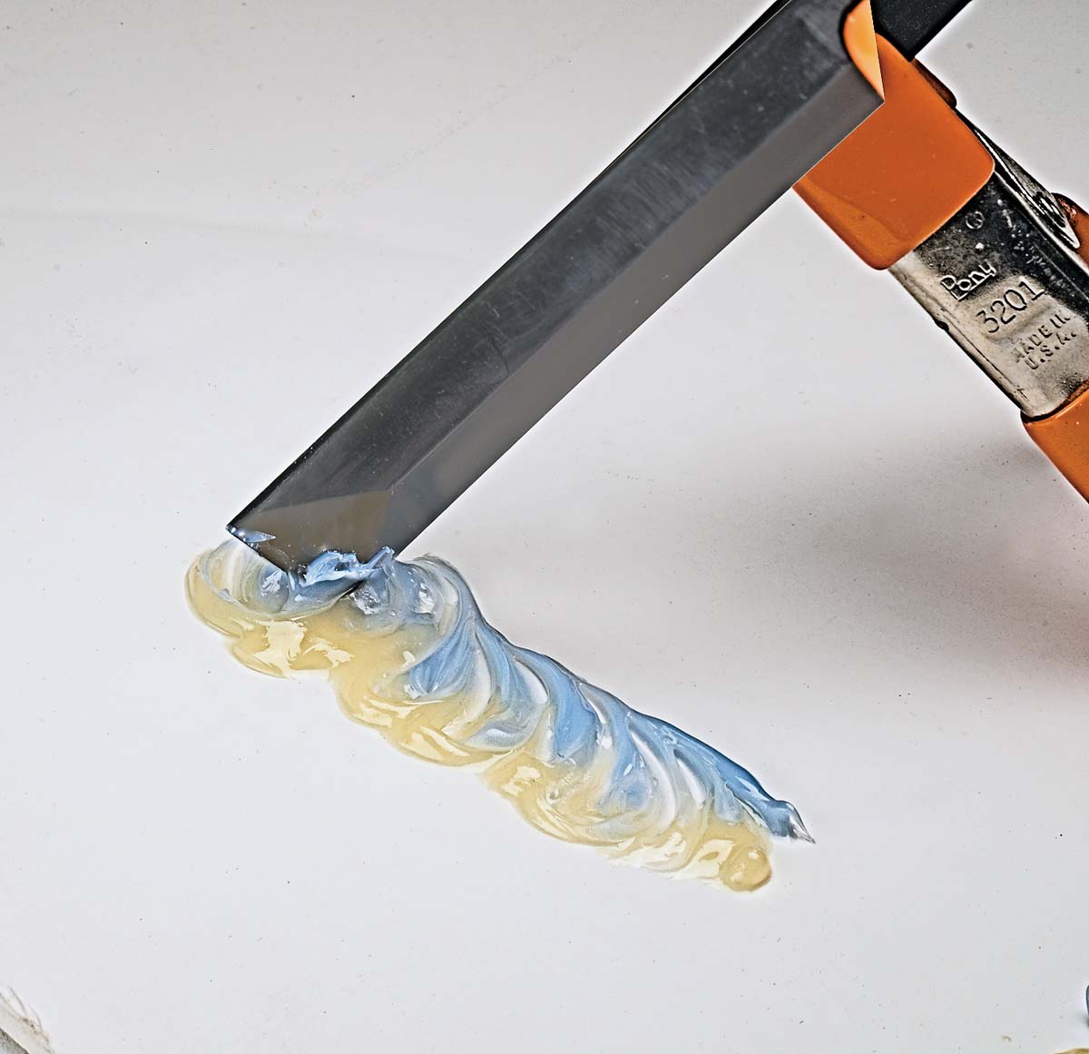 square-tipped spatula and combine resin and hardener in a swirling motion