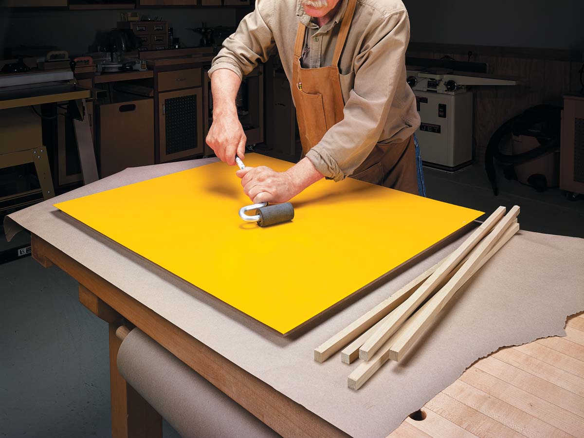 using roller to make sure laminate is nice and smooth