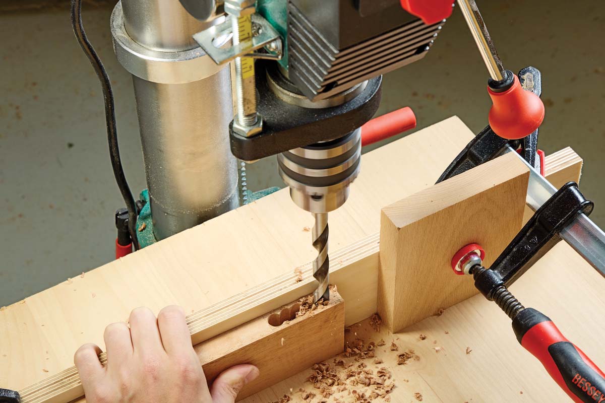 driling series of overlapping holes in side of wood