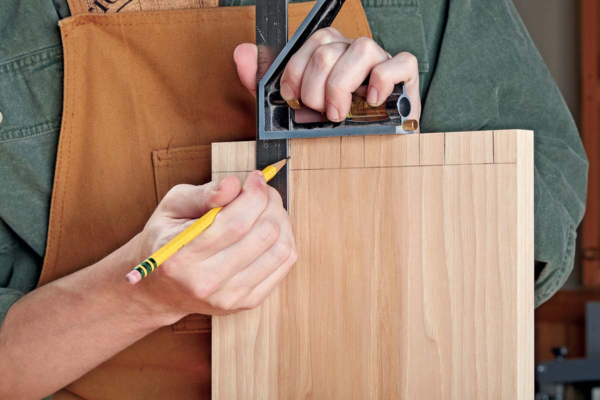 using pencil to mark dovetails on opposite side