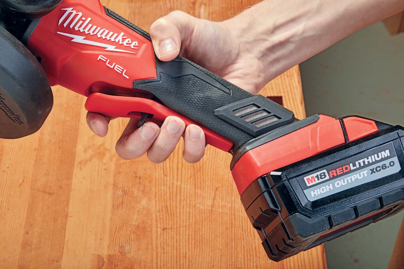 *Milwaukee’s* cordless grinder ergonomic paddle swich grip