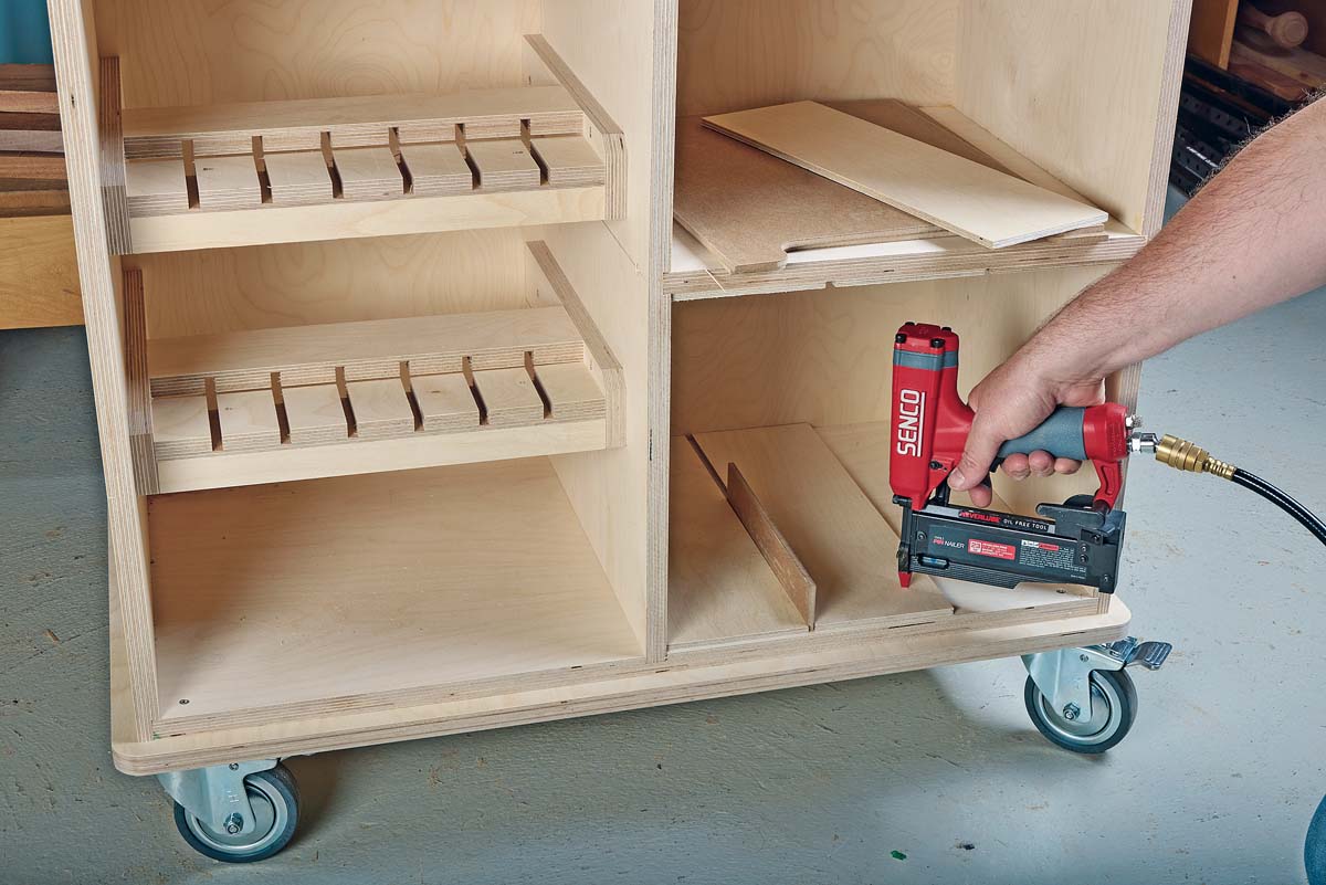 drilling down wood panel with red SENCO drill