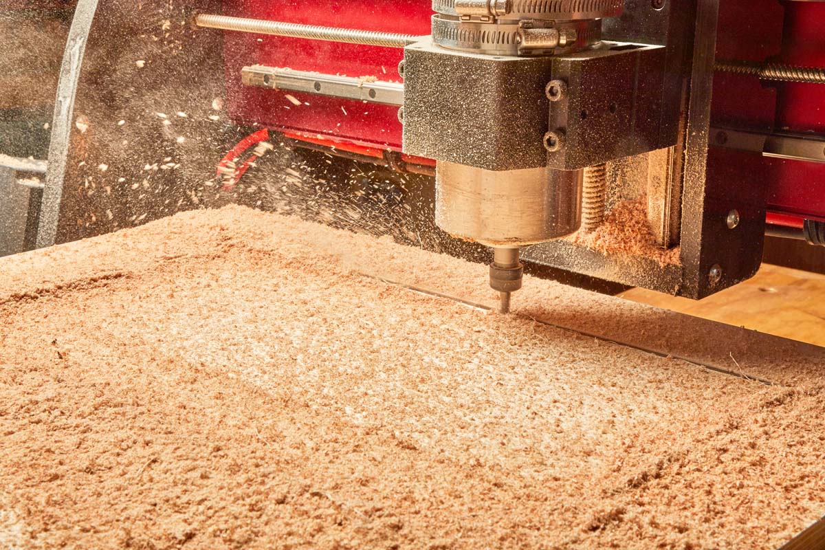 CNC router spraying off large wood chips