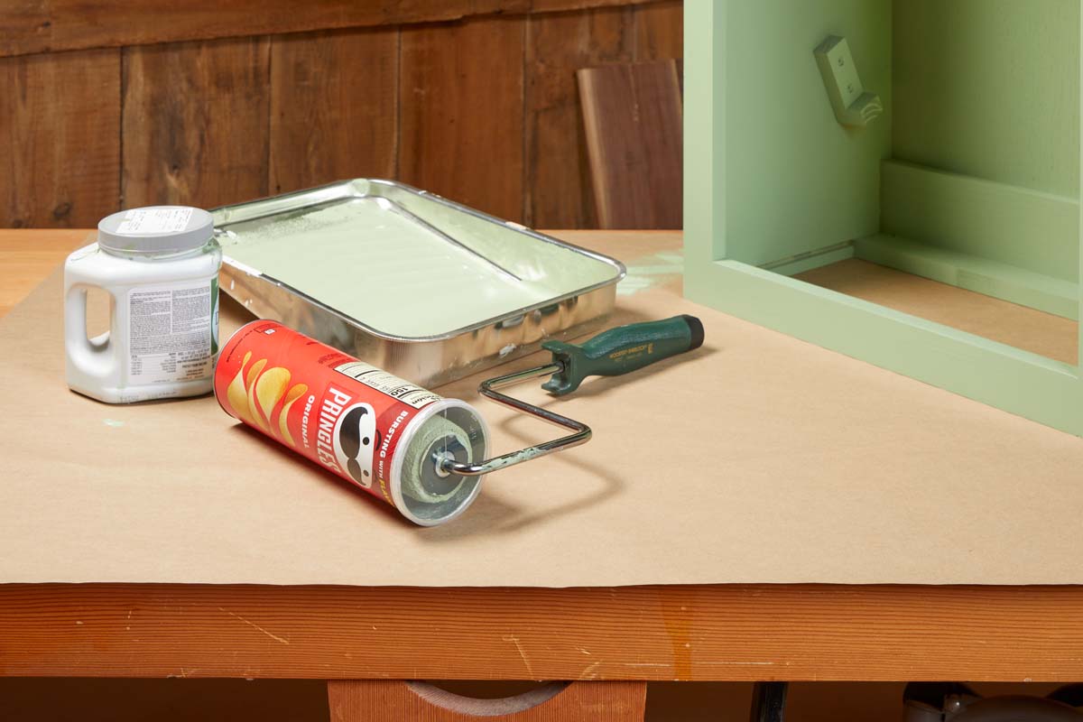 old pringles can holding paint roller