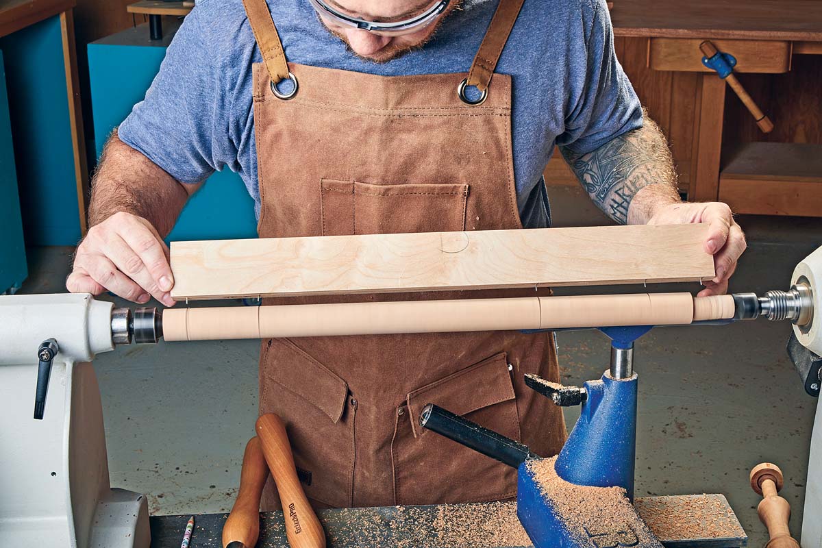 scoring wood with clipped nails in a piece of plywood