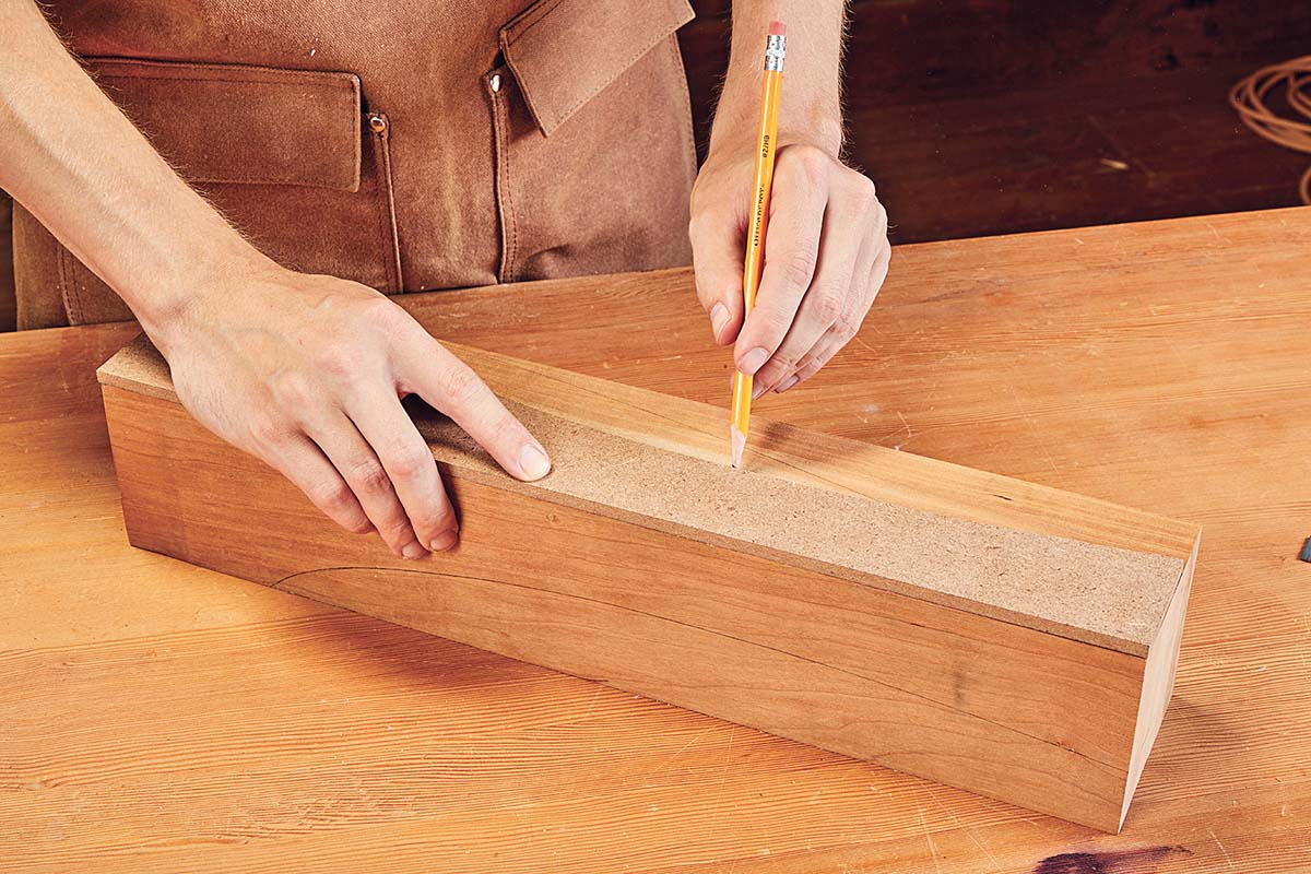 using hardboard template to pencil mark curves on wood