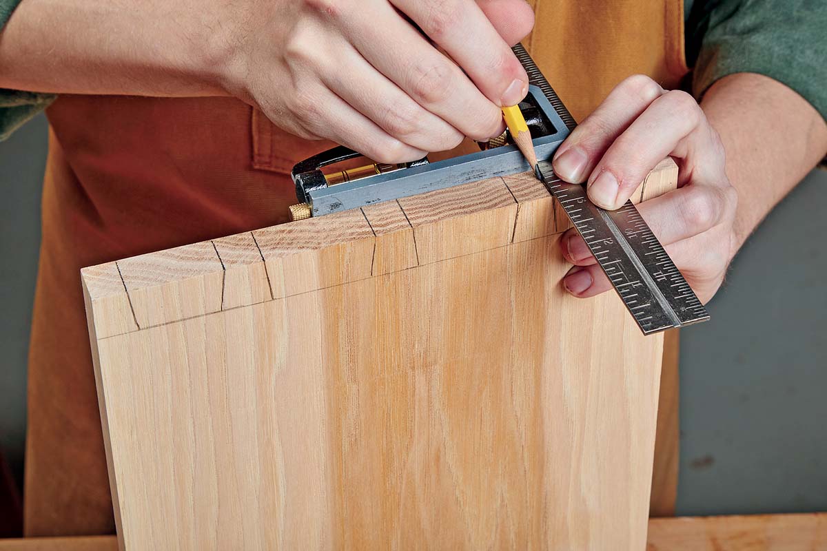 using ruler and square to transfer over pins for tail ends