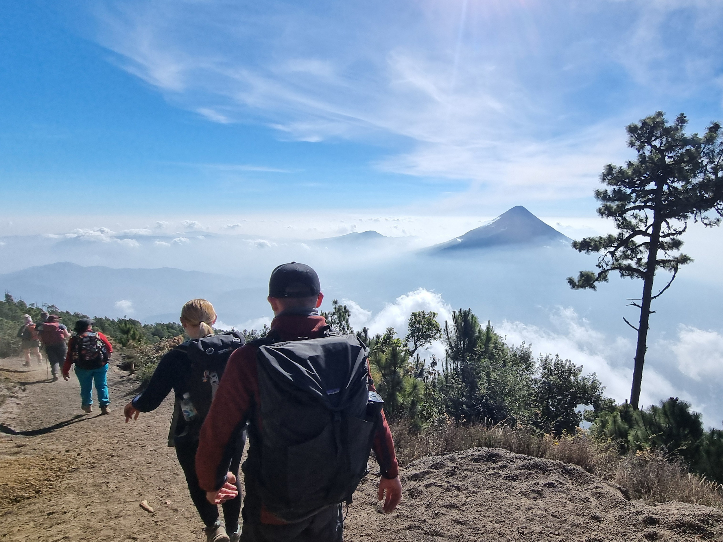 Trekkers climbing Acatenango above the clouds, Guatemala