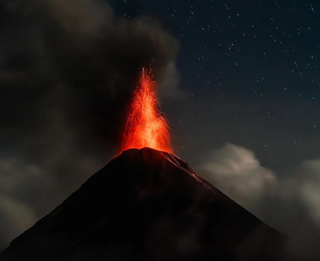 Volcán de Fuego erupting at night