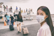 Asian woman tourist boarding plane taking a flight in China