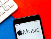 Apple Music logo is seen displayed on a smartphone